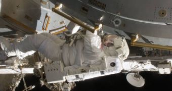 Astronaut Tim Kopra, mission specialist, is pictured during the first of five planned spacewalks to be performed on the International Space Station by the STS-127 crew