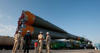 A September 28 picture of the Soyuz rocket being delivered by railcar from its assembly building to the Site 254 launch pad, at the Baikonur Cosmodrome, in Kazakhstan