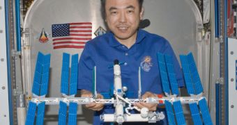 Satoshi Furukawa and the LEGO model of the ISS he built while in Earth's orbit (click for full resolution)