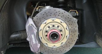 A reinforced carbon brake disc installed on a Ferrari F430 Challenge race car. They squeal too