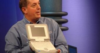 Intel CEO Paul Otellini Holding a Classmate PC