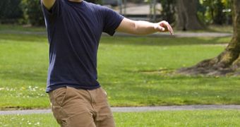 A Frisbee player catches the frisbee