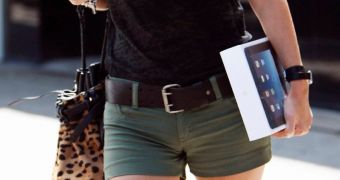 Woman carrying iPad
