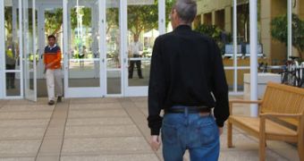 Steve Jobs photographed from behind on Cupertino campus