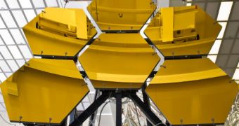 Engineers and technicians guide six JWST mirror segments off the rails after completing final cryogenic testing at the MSFC