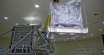 n this photograph the ISIM structure is in the process of being loaded onto the centrifuge at NASA's Goddard Space Flight Center, Greenbelt, Maryland