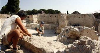 Archaeologists work in Rome on the ruins of a 2nd-century bath complex believed to be part of a vast, luxurious residence of a billionaire