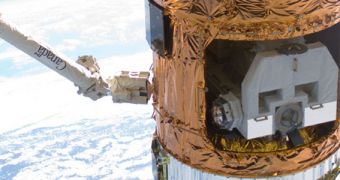 This image shows the JAXA HTV-2 capsule, docked to the ISS during a resupply run in early 2011