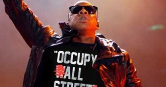 Jay-Z wears his own Rocawear t-shirt, apparently in support of the Occupy Wall Street movement