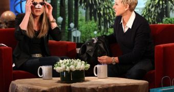 Jennifer Aniston tries out the gifts she got from Ellen DeGeneres