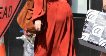 Jessica Simpson is so pregnant she can no longer wear high heels, she is heard saying