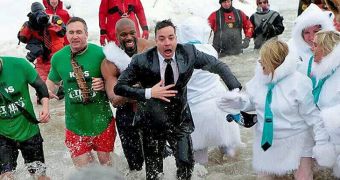 Jimmy Fallon takes a daring plunge in the ice-cold waters of Lake Michigan for charity