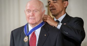 The first NASA astronaut to reach orbit, John Glenn, receives the Presidential Medal of Freedom from US President Barack Obama, on May 29, 2012