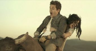 John Mayer and Katy Perry enjoy a bull ride in their latest video