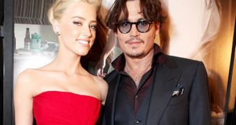 Johnny Depp, Amber Heard Photographed Holding Hands at Rolling Stones Concert