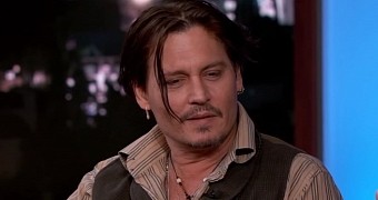 Johnny Depp says he always has music playing in his ear when he's acting