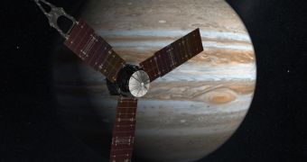 The NASA Juno spacecraft passes in front of Jupiter in this artist's depiction