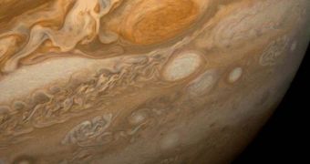 A view of the massive Great Red Spot on Jupiter. Three Earths can be fitted within the diameter of the structure