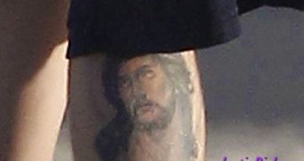 A closeup of Justin Bieber's new Jesus tattoo on his left calf