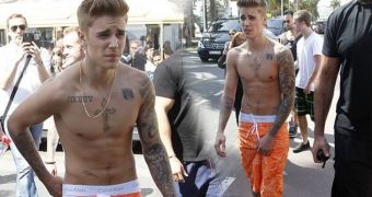 Justin Bieber shows up shirltess at the Cannes Film Festival, thinks he's too cool for shirts and long pants