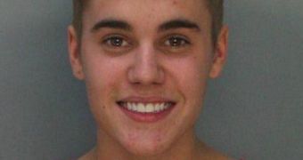 Justin Bieber grins as he’s being booked for DUI, drag racing and driving on a suspended violence
