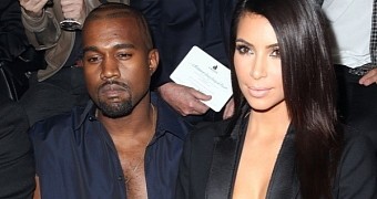 Kanye West and Kim Kardashian donned matching low-cut cleavages for the Lanvin show at Paris Fashion Week