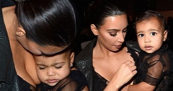 Doting mother Kim Kardashian snaps at husband Kanye when he physically educates their daughter