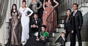The Kardashian clan strikes awkward pose for the traditional Christmas card