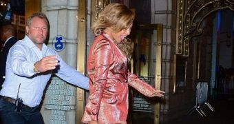 Beyonce exits the theater in New York with the widest smile on her face