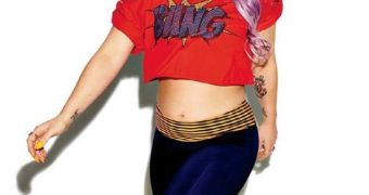 Kelly Osbourne shows off her toned tummy in new magazine photospread