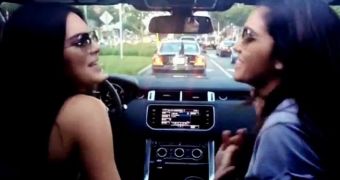 Kendall Jenner fails to look at the road while driving, because she's too busy singing