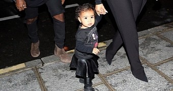 Kanye West, Kim Kardashian and baby North at the Balenciaga fashion show in Paris
