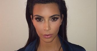 Kim Kardashian Flashes Cleavage in New Passport Photo, Is the Image of Class