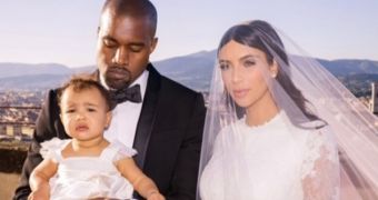 “My everything,” says Kim Kardashian of wedding photo with Kanye West and daughter North