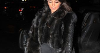 Kim Kardashian Shows Off Baby Bump, Struts in Tight Dress, Fur Coat