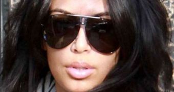 Kim Kardashian blames blown-up lips on the flu, says she'd never get fillers