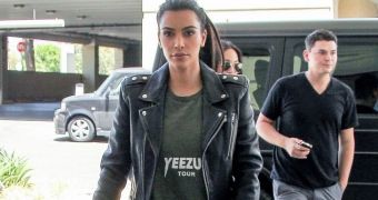 Kim Kardashian supports Kanye West’s musical endeavors with Yeezus tour T-shirt