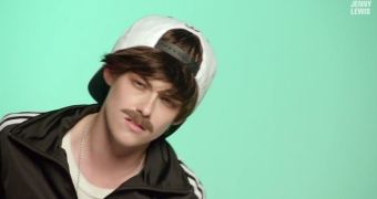 Kristen Stewart in drag, with a Justin Bieber-style wig and fake moustache