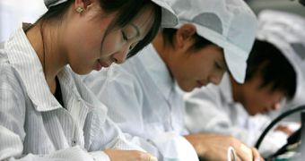 Chinese workers assembling Apple products
