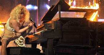 Lady Gaga is a total pro after she falls from her piano in live concert