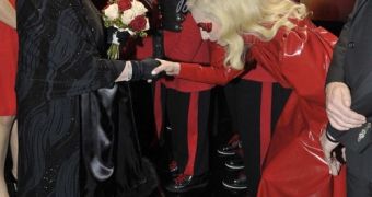 Lady Gaga curtsies before the Queen of England