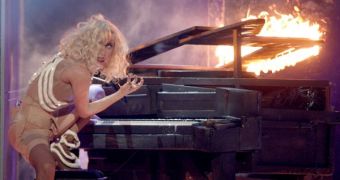 Lady Gaga performs “Speechless” on flaming piano, surrounded by broken glass