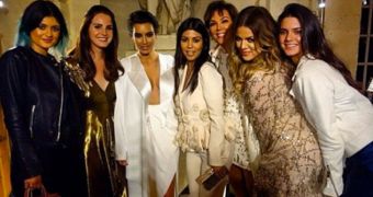 Lana Del Rey poses with the Kardashians after playing at the pre-wedding party