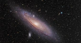A new photo of the Andromeda Galaxy. It has been cannibalizing on at least two smaller galaxies over the past few billions of years, a new study shows