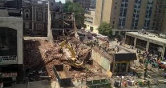 Police investigate the deadly collapse of a building