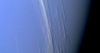 This close-up image shows high-altitude clouds obscuring the view of Neptune's surface