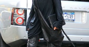 Lenny Kravitz in leather pants and knee-high wedge leather boots