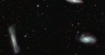 Triplet of bright galaxies in the constellation of Leo (The Lion), together with a multitude of fainter objects: distant background galaxies and much closer Milky Way stars