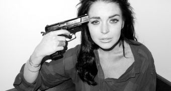 Lindsay Lohan Criticized for Posing with Gun, Mocking Suicide