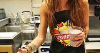 Lindsay Lohan making and serving milkshake at Millions of Milkshakes in LA
